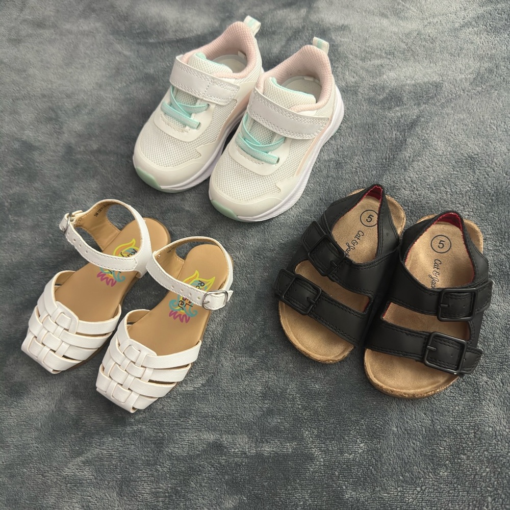 Three pairs of girls' shoes, two in size (5) and one in size (4)